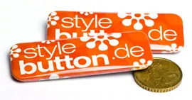 rechteckige Buttons im Größenvergleich zu 50 ct Münze